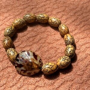 Natural Bodhi Seed Bracelet with a oval limpet seashell Accent